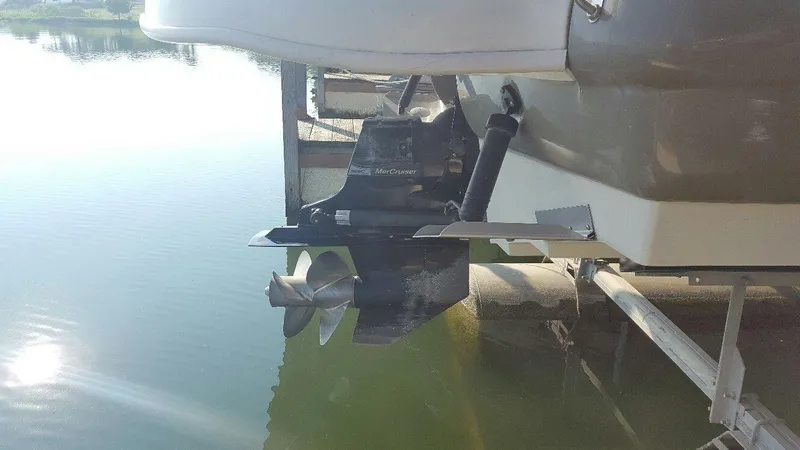 Slide: The Image of 2008 Sea Ray 240 Sundeck boat propeller and stern in calm water. - 15