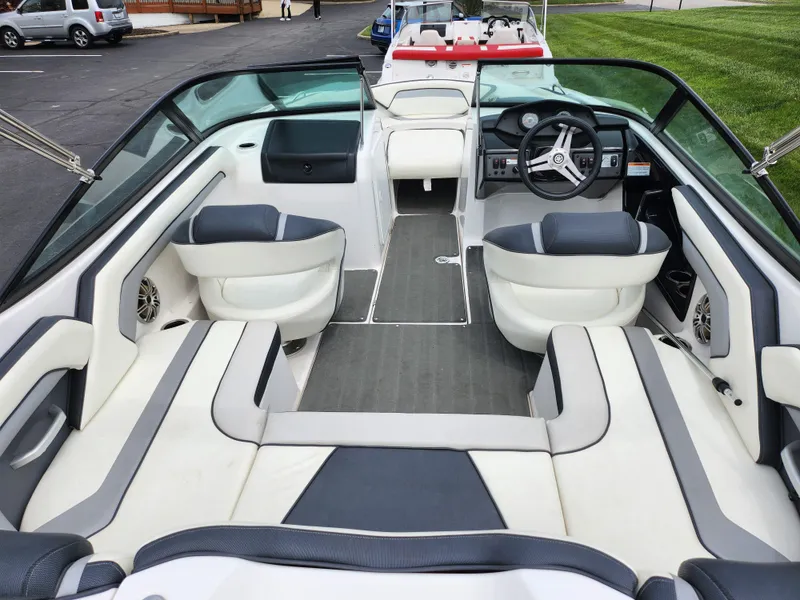 Slide: The Image of 2017 Yamaha Boats SX195 interior with sleek seating and modern dashboard design. - 11