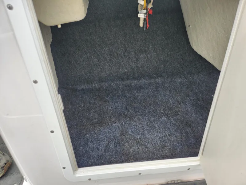 Slide: The Image of 2017 Yamaha Boats SX195 interior carpeted floor view. - 17