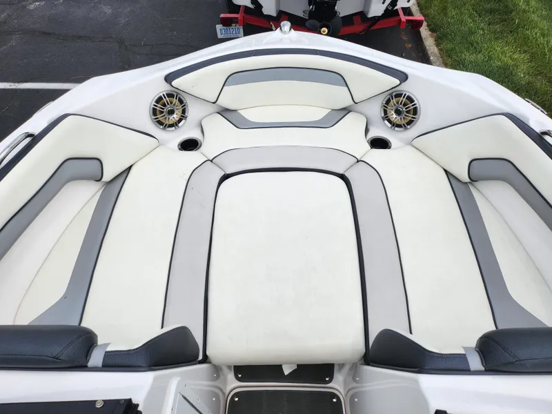 Slide: The Image of 2017 Yamaha Boats SX195 interior with white and gray seating, featuring built-in speakers. - 18