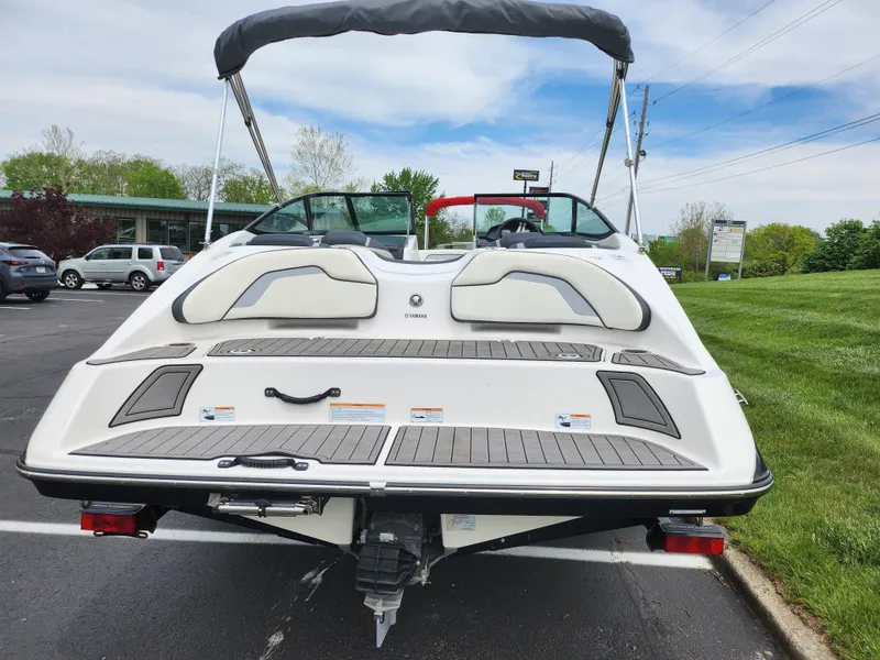 Slide: The Image of 2017 Yamaha Boats SX195, rear view, parked outdoors on a sunny day. - 2