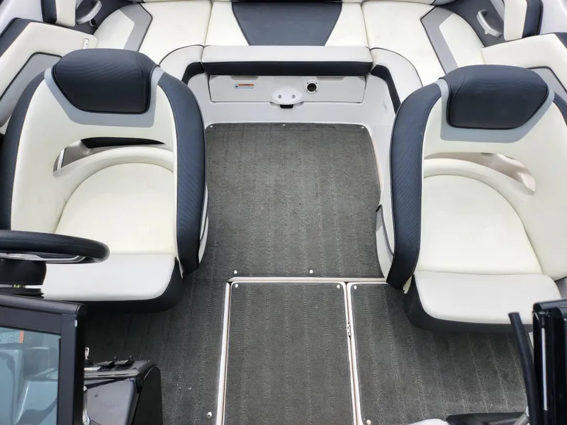 Slide: The Image of 2017 Yamaha Boats SX195 interior with dual seating and carpeted flooring. - 21