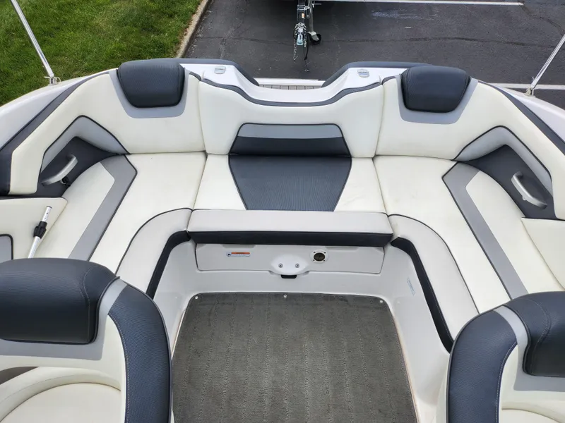 Slide: The Image of 2017 Yamaha Boats SX195 interior seating with gray and white upholstery. - 22