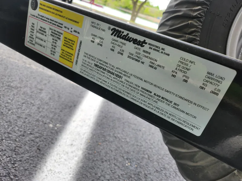 Slide: The Image of Label on a 2017 Yamaha Boats SX195 trailer by Midwest Industries, showing specifications and safety standards. - 8