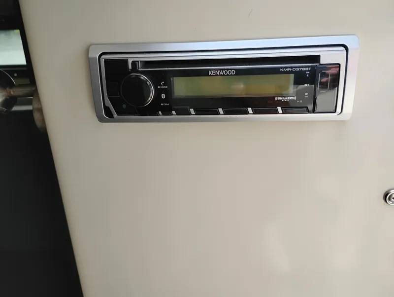 Slide: The Image of Kenwood stereo system in 1989 Boston Whaler 22 Renegade Cabin boat interior. - 19