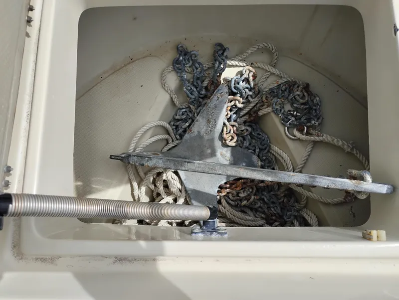 Slide: The Image of Anchor and rope storage in 1989 Boston Whaler 22 Renegade Cabin boat. - 35