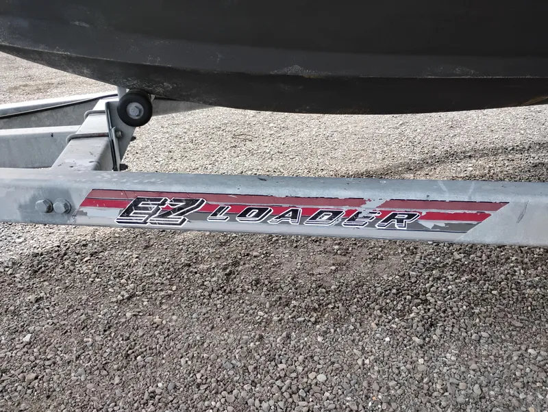 Slide: The Image of Trailer for 1989 Boston Whaler 22 Renegade Cabin, featuring EZ Loader branding. - 36