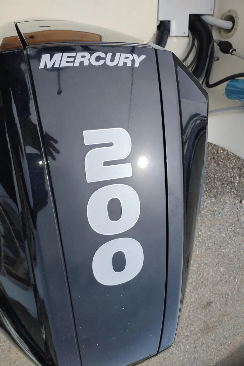 Slide: The Image of Mercury 200 outboard motor on 1989 Boston Whaler 22 Renegade Cabin boat. - 5