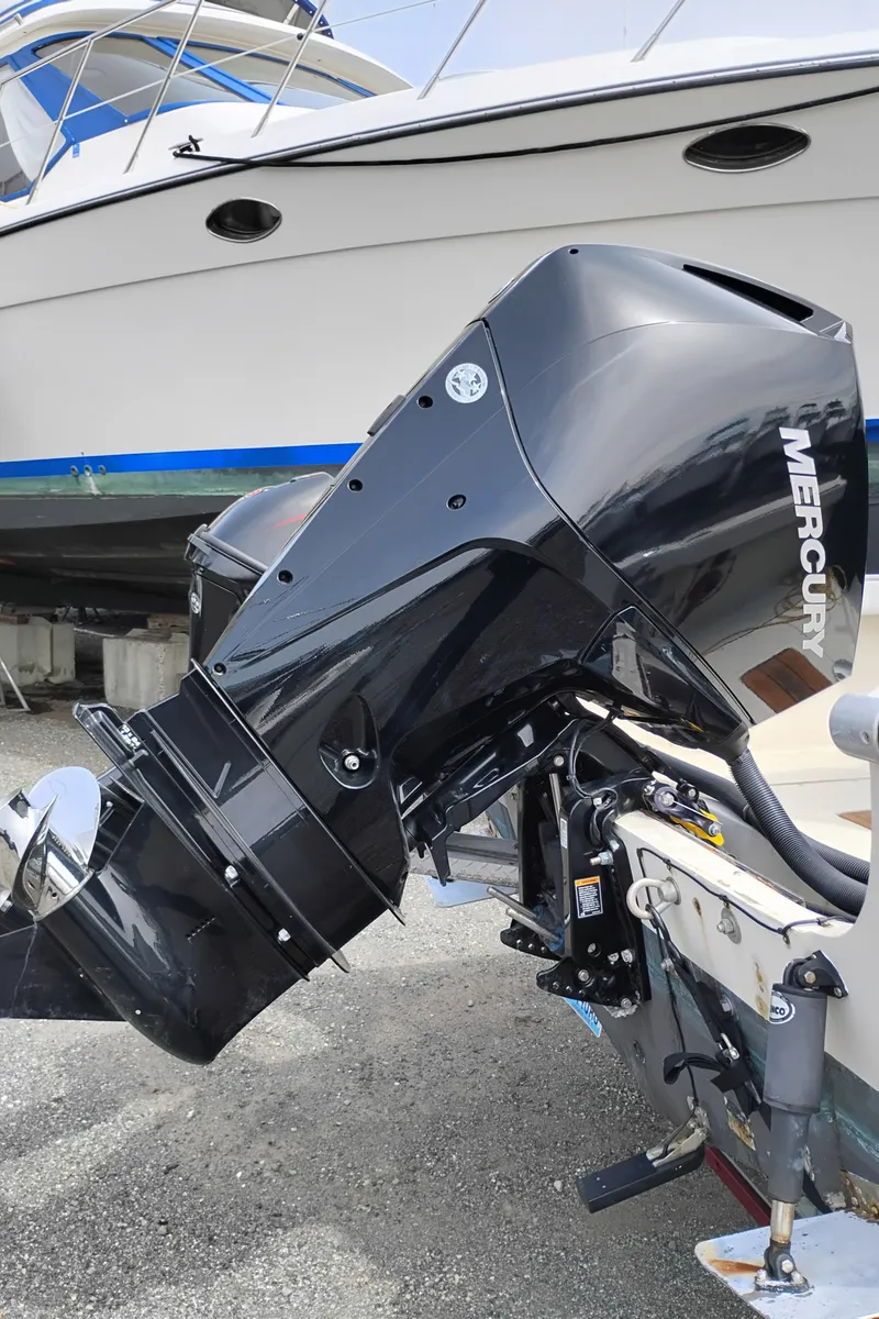 Slide: The Image of 1989 Boston Whaler 22 Renegade Cabin with Mercury outboard motor. - 8