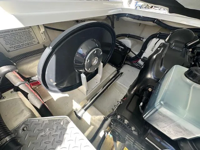Slide: The Image of Engine compartment of a 2018 Formula 270 Bowrider boat, showcasing mechanical components. - 17