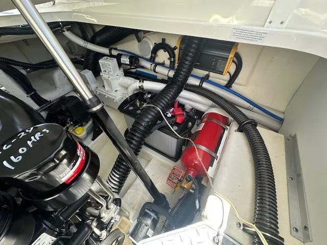 Slide: The Image of Engine compartment of a 2018 Formula 270 Bowrider with visible wiring and components. - 18