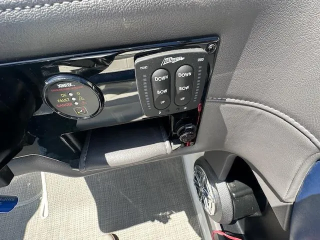Slide: The Image of Control panel of a 2018 Formula 270 Bowrider boat with trim and audio controls. - 21