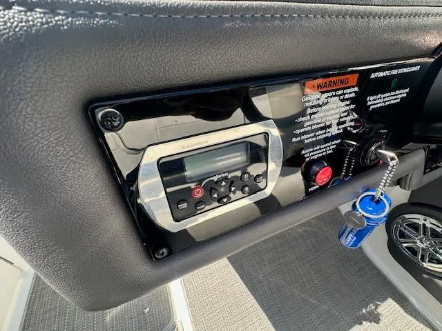 Slide: The Image of Control panel of a 2018 Formula 270 Bowrider boat with warning label and keychain. - 23