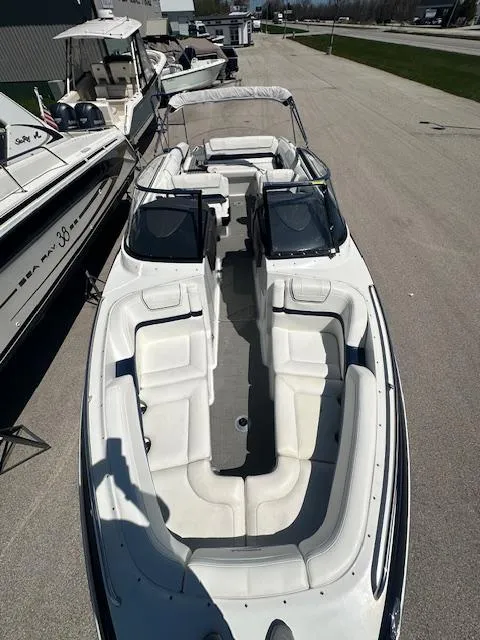 Slide: The Image of 2018 Formula 270 Bowrider boat with spacious seating, docked outdoors. - 26