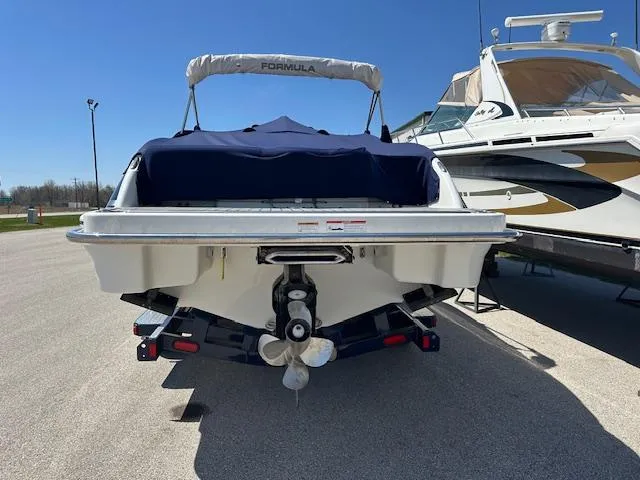 Slide: The Image of 2018 Formula 270 Bowrider boat, rear view, on trailer, sunny day. - 8