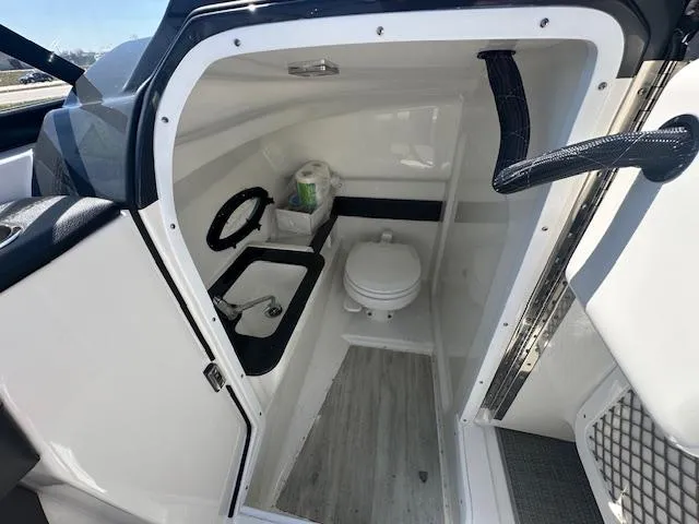 Slide: The Image of 2018 Formula 270 Bowrider boat interior with compact bathroom and toilet. - 9
