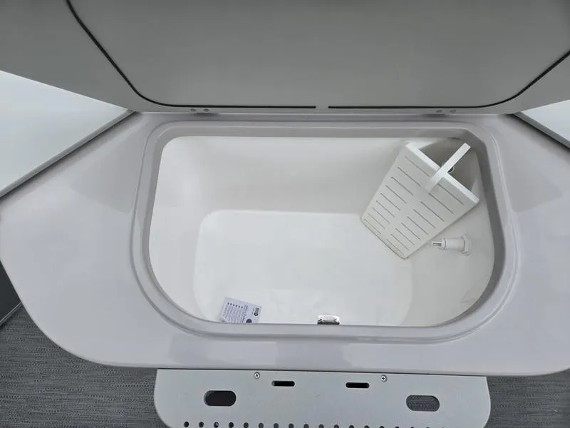 Slide: The Image of Open storage compartment in 2025 Godfrey Sweetwater 2286 FS boat. - 23