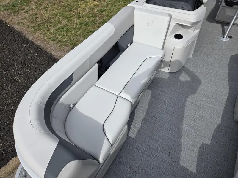 Slide: The Image of 2025 Godfrey Sweetwater 2286 FS boat interior with gray seating and storage compartment. - 6