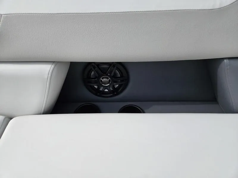 Slide: The Image of 2025 Godfrey Sweetwater 2286 FS boat interior with speaker and cup holders. - 8