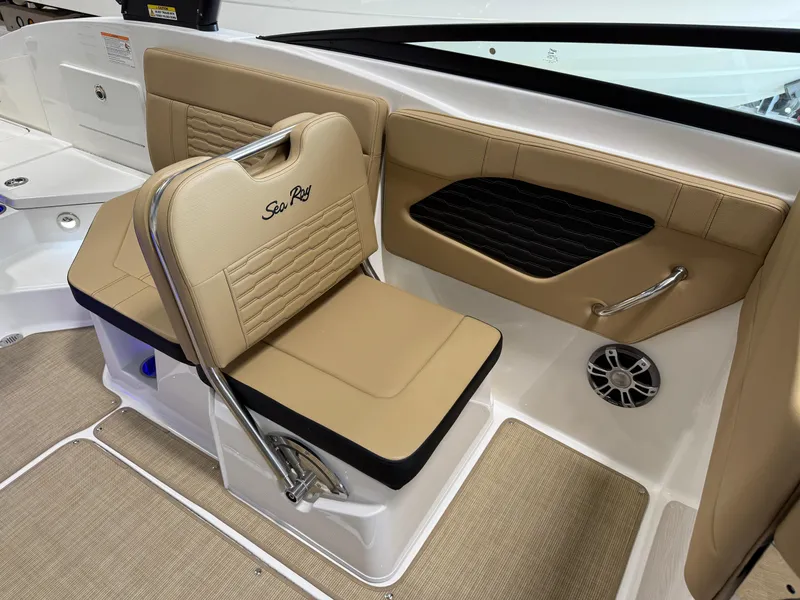 Slide: The Image of 2025 Sea Ray SPX230 boat interior with tan seating and modern design. - 16