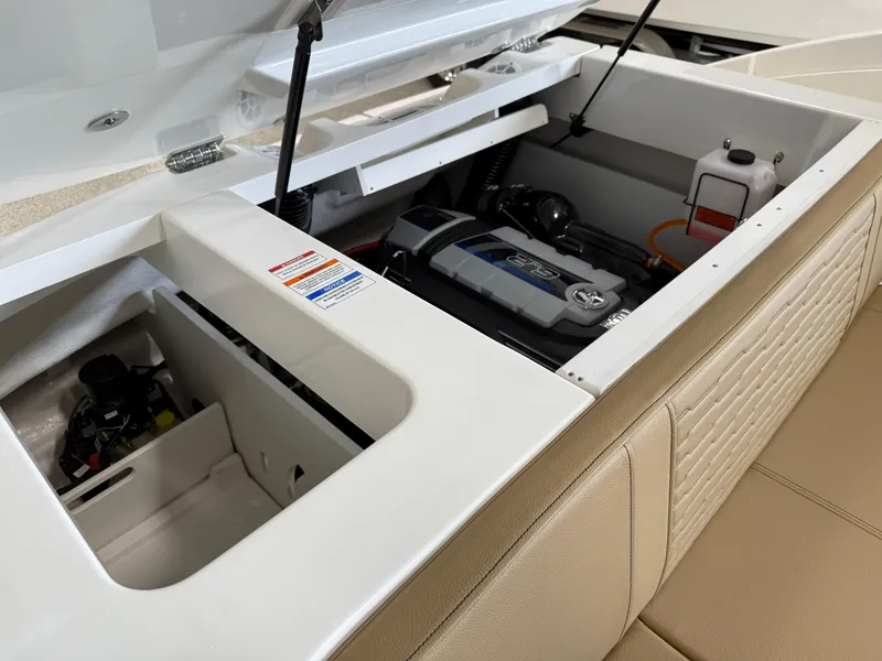 Slide: The Image of 2025 Sea Ray SPX230 boat engine compartment with open hatch, showcasing modern design. - 22