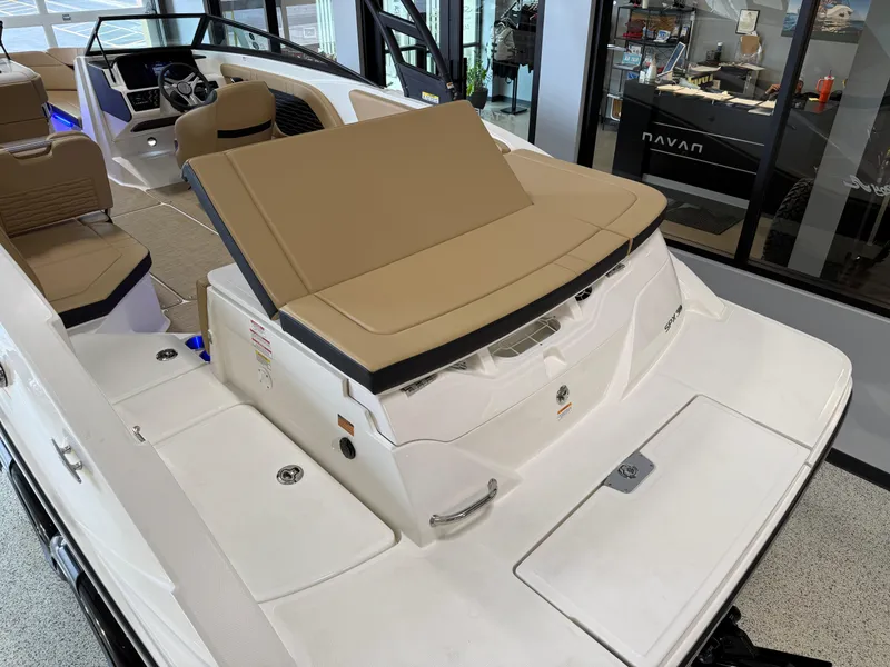 Slide: The Image of 2025 Sea Ray SPX230 boat interior with tan seating and modern design. - 25
