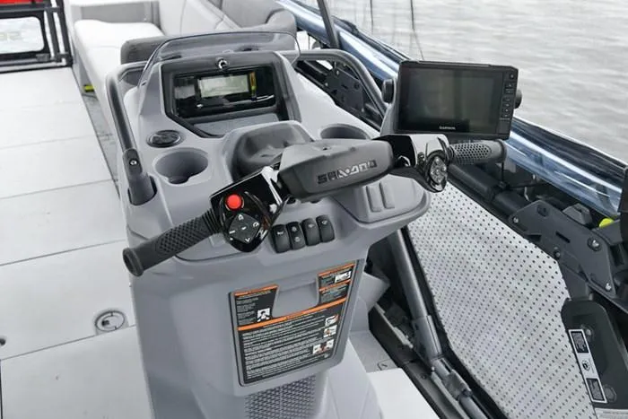 Slide: The Image of 2024 Sea-Doo Switch® Cruise 18 dashboard with controls and navigation screens. - 7