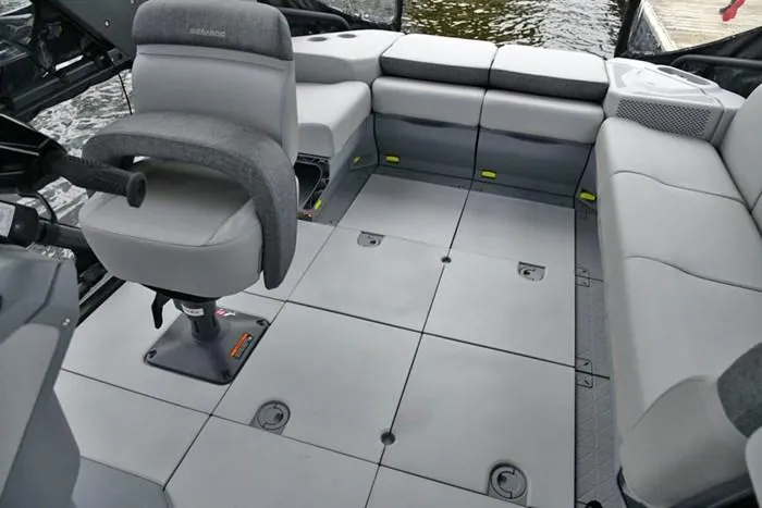 Slide: The Image of 2024 Sea-Doo Switch® Cruise 18 interior with seating and helm, showcasing spacious design. - 9