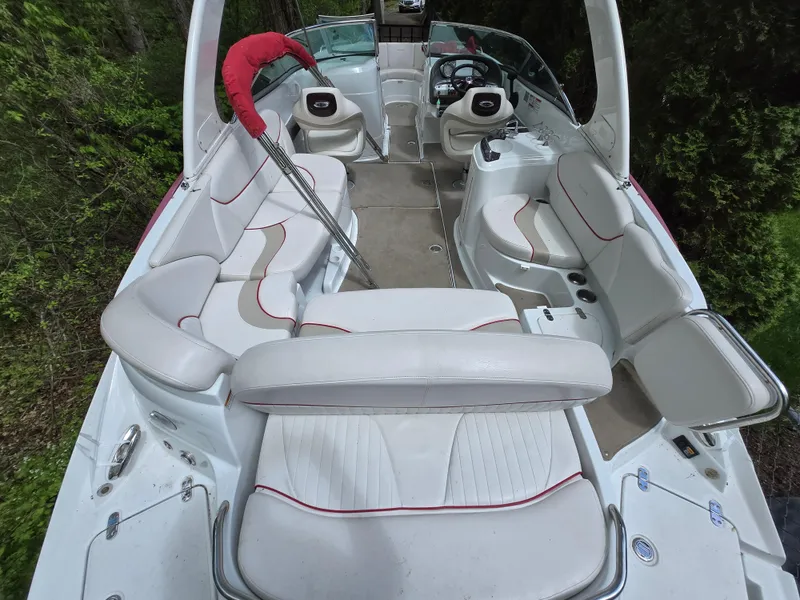 Slide: The Image of Interior of a 2009 Azure AZ298 boat with white seating and red accents. - 11