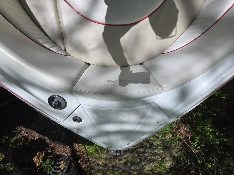 Slide: The Image of Bow of 2009 Azure AZ298 boat with white seating and red trim. - 13