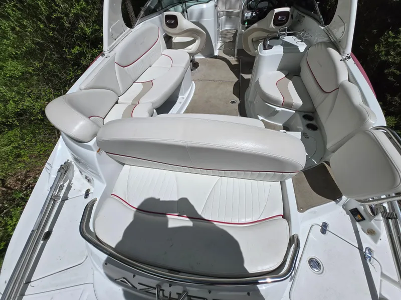 Slide: The Image of 2009 Azure AZ298 boat interior with white seating and red accents. - 16