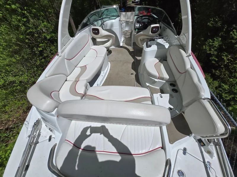 Slide: The Image of 2009 Azure AZ298 boat interior with white seating and red accents. - 17