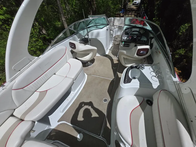 Slide: The Image of 2009 Azure AZ298 boat interior with white seating and steering console. - 20