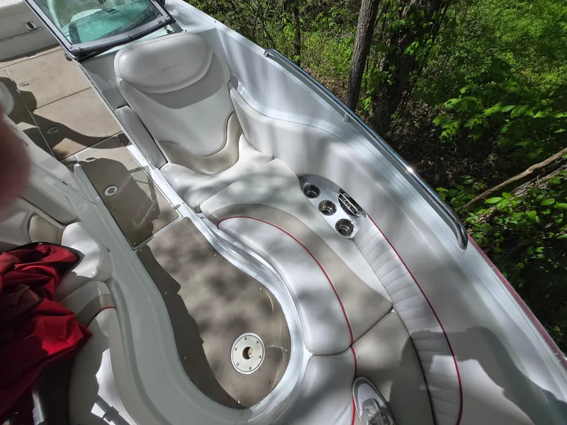 Slide: The Image of Interior of 2009 Azure AZ298 boat with white seating and cup holders. - 24