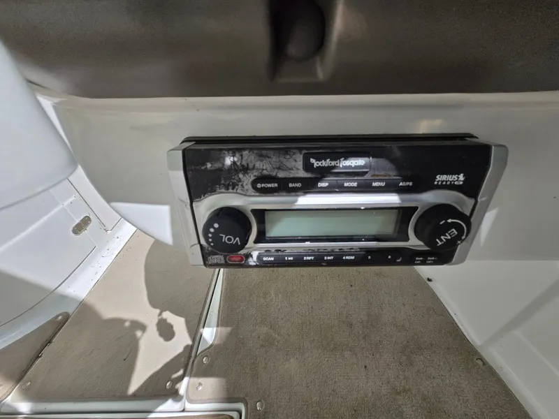 Slide: The Image of Boat stereo system in a 2009 Azure AZ298, featuring Rockford Fosgate controls. - 29