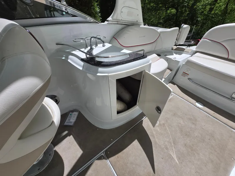 Slide: The Image of 2009 Azure AZ298 boat interior with open storage, sink, and seating. - 31