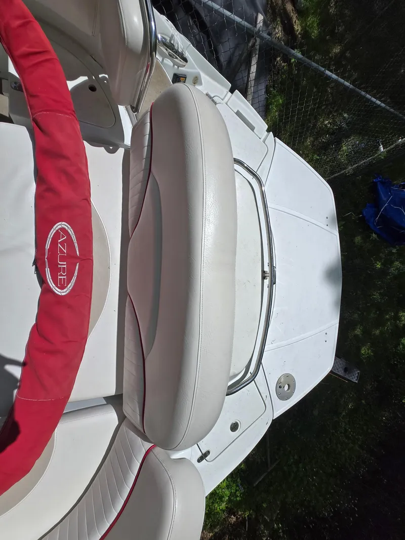 Slide: The Image of White and red interior of 2009 Azure AZ298 boat, featuring comfortable seating. - 35