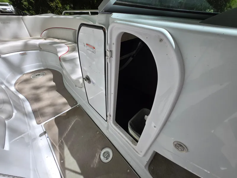 Slide: The Image of Interior view of a 2009 Azure AZ298 boat with open storage compartment. - 36