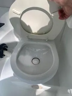 Slide: The Image of Boat toilet in an Azure AZ298 model, 2009, with open lid and visible plumbing. - 40