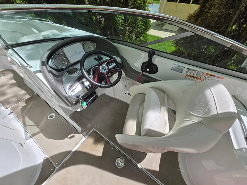 Slide: The Image of 2009 Azure AZ298 boat interior with steering wheel and seating. - 6