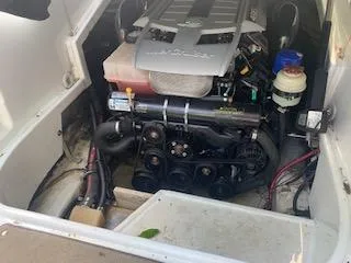 Slide: The Image of Engine compartment of a 2009 Azure AZ298 boat, showcasing mechanical components and wiring. - 7