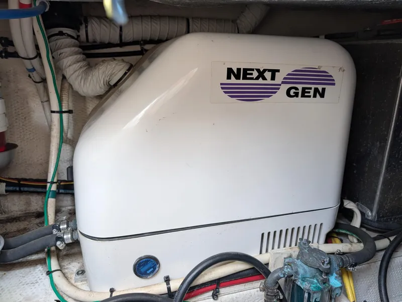 Slide: The Image of Engine compartment of 2010 Mainship Pilot 31 with Next Gen generator. - 22