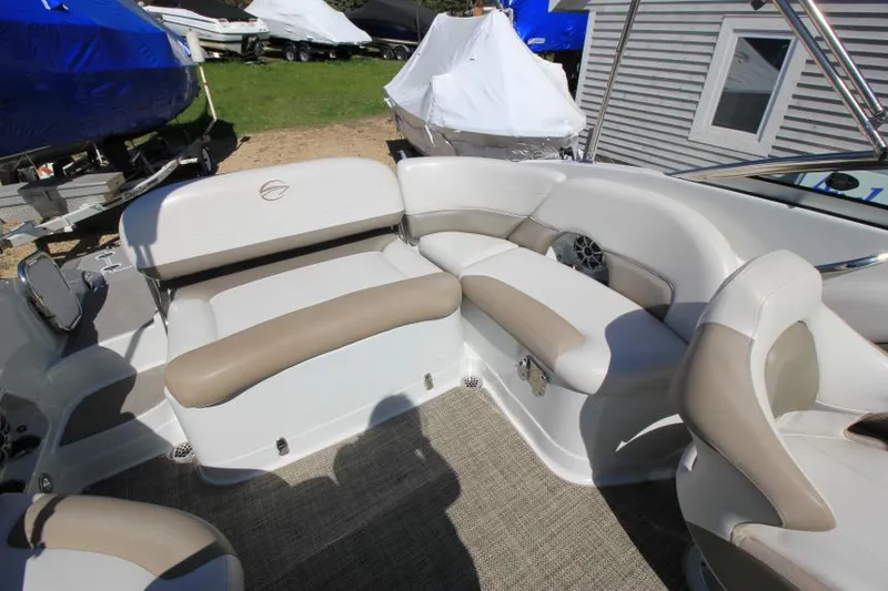 Slide: The Image of 2016 Crownline Eclipse E2 boat interior with beige and white seating. - 11