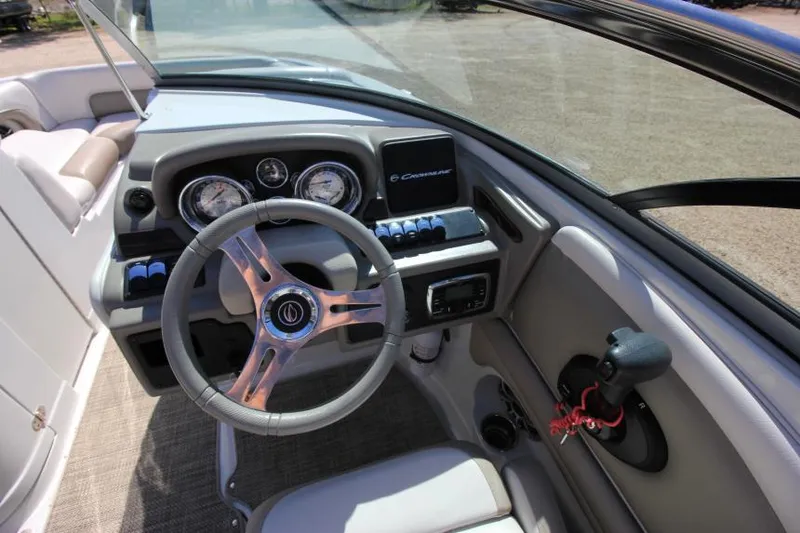 Slide: The Image of 2016 Crownline Eclipse E2 boat dashboard with steering wheel and control panel. - 14