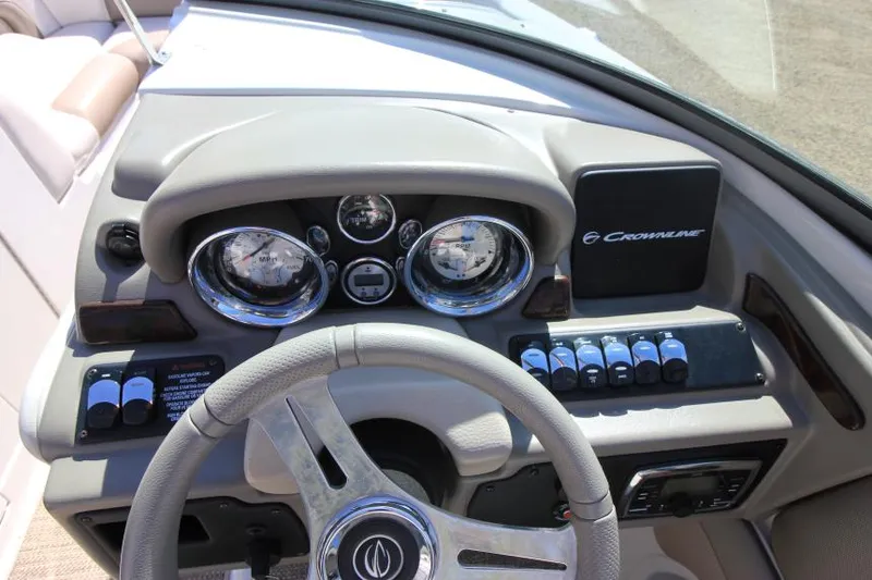 Slide: The Image of 2016 Crownline Eclipse E2 dashboard with steering wheel and control panel. - 15