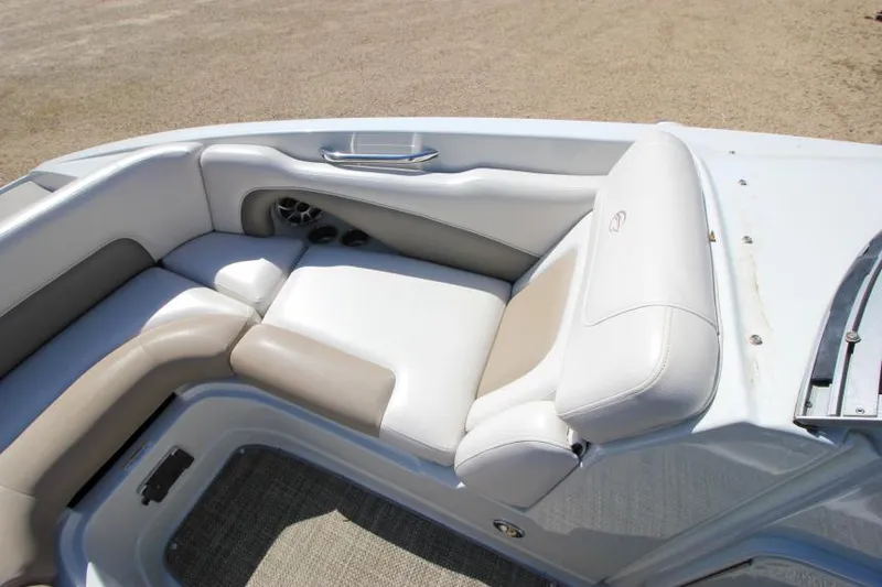 Slide: The Image of 2016 Crownline Eclipse E2 boat interior with beige and white seating. - 21
