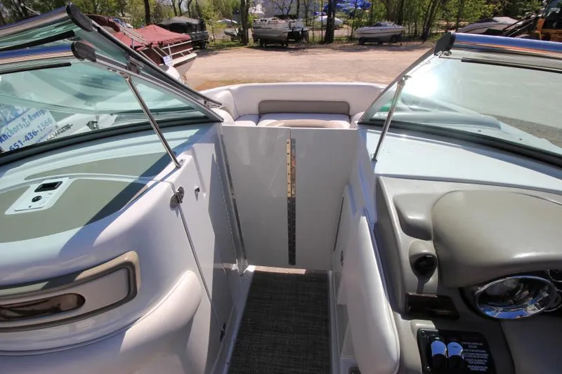 Slide: The Image of 2016 Crownline Eclipse E2 boat interior with open windshield and seating area. - 25