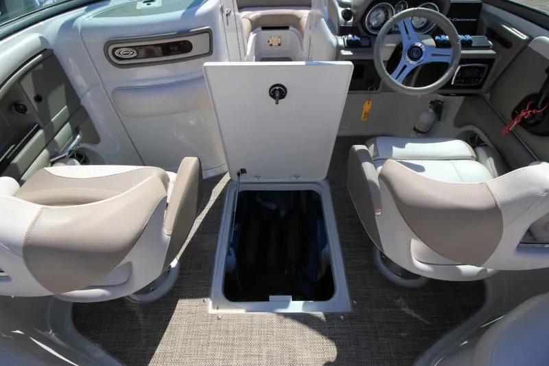 Slide: The Image of 2016 Crownline Eclipse E2 boat interior with open storage compartment and seating. - 27