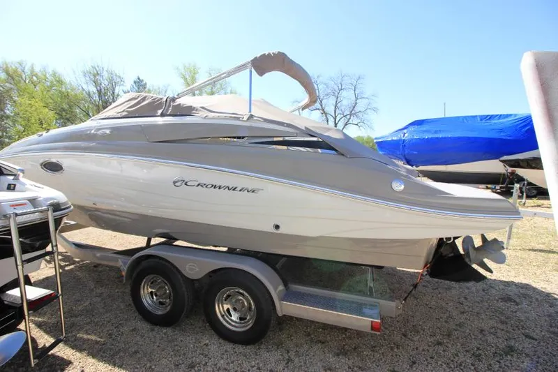 Slide: The Image of 2016 Crownline Eclipse E2 boat on trailer, parked outdoors. - 3