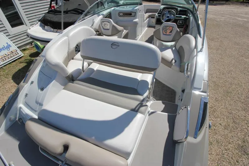 Slide: The Image of 2016 Crownline Eclipse E2 boat interior with plush seating and modern dashboard. - 7